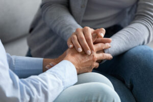 Two people holding hands.