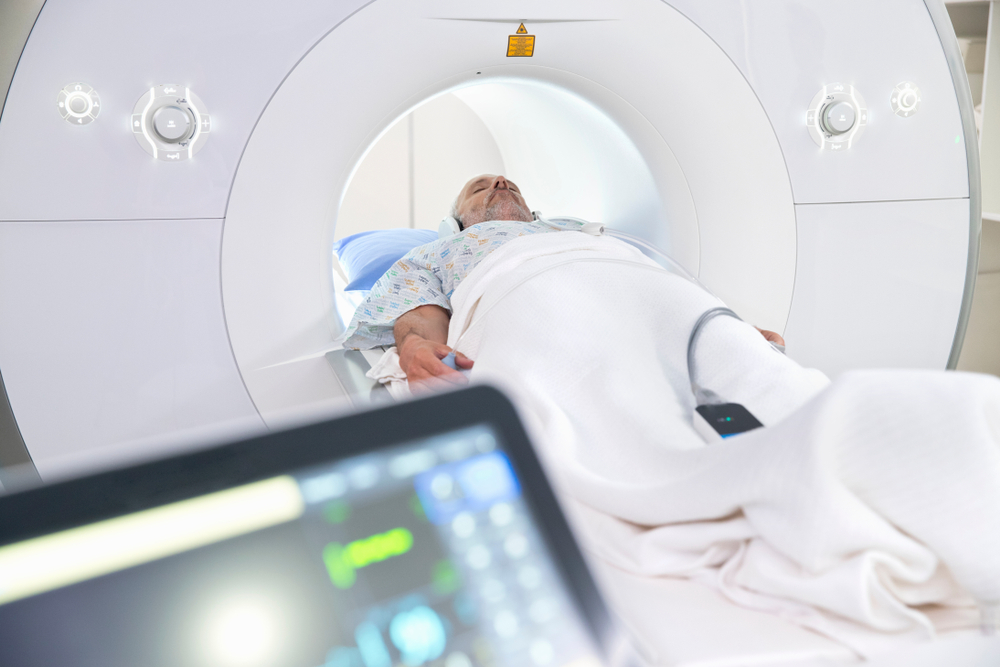 male patient entering MRI scanning machine
