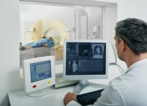 A doctor and patients in a imaging room.